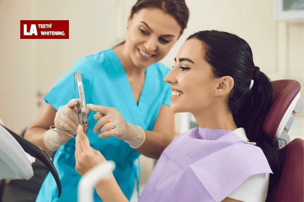 Person looking in a mirror, symbolizing the importance of realistic whitening goals Tamworth